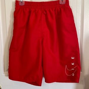 Boys red Nike swim trunks. Size boys L 10-12.